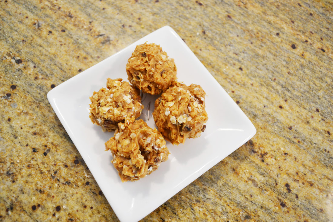 Easy energy bites that taste like cookie dough plated on a white plate